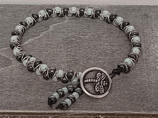 Cast metal shank button beaded bracelet, on leather cord. Glass bracelet, shank button bracelet.